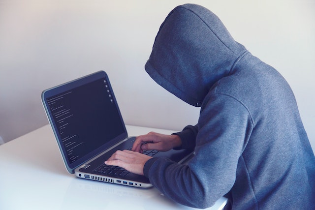 Hacker on laptop