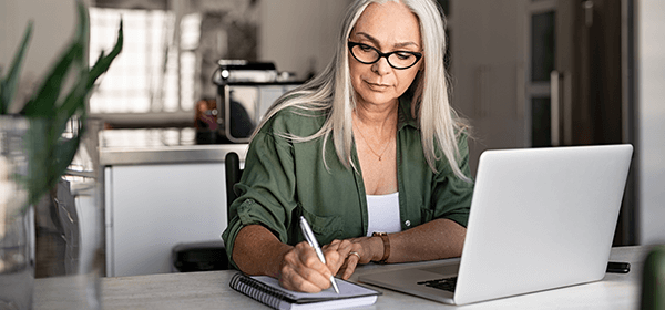 Tip 6 - Lifestyle image of mature woman working from home