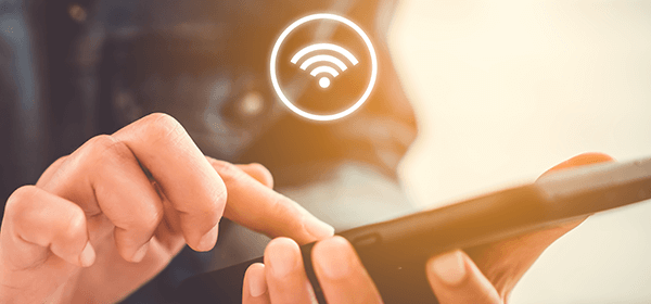 Tip 3 - Lifestyle image of person on a phone connecting to wifi